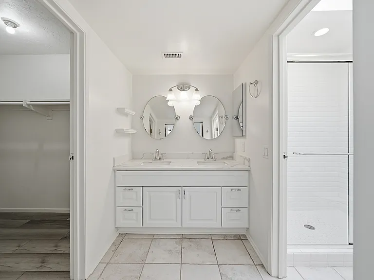 Primary Ensuite with Dual vanity, walk in shower, walk in closet.