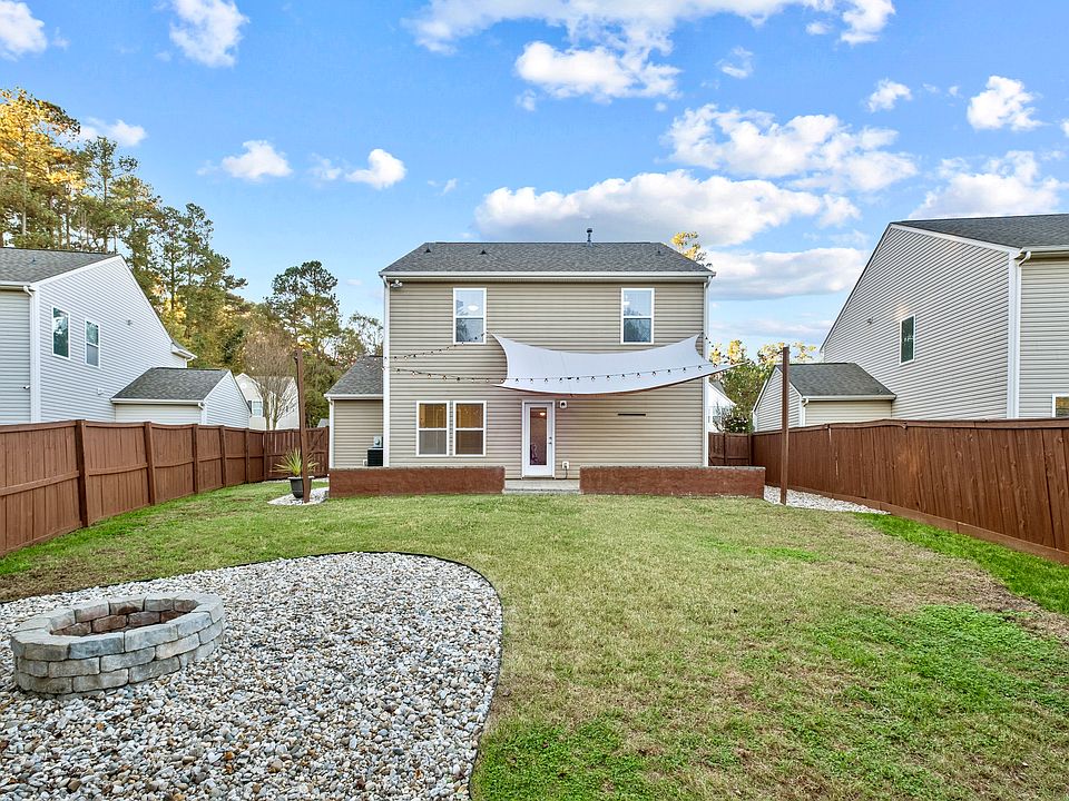 Step outside to a fully fenced in backyard designed for both relaxation and entertainment. Enjoy a spacious patio that is perfect for gatherings, a cozy fire pit area for unwinding in the evenings, and a convenient turf area for pet relief
