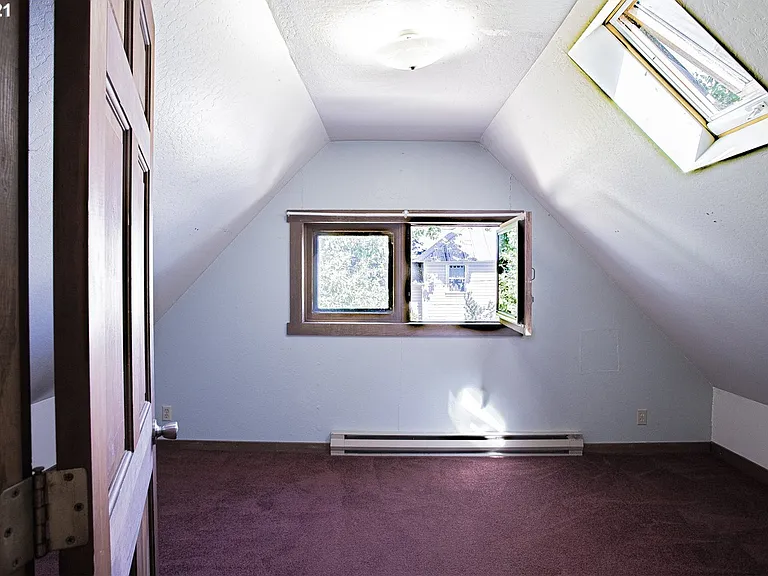 upper bedroom #2 with skylights