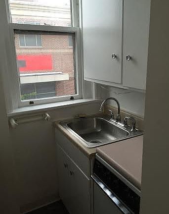 Galley kitchen with new stainless steel sink