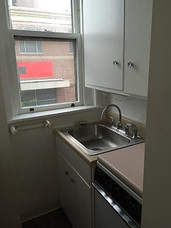 Galley kitchen with new stainless steel sink