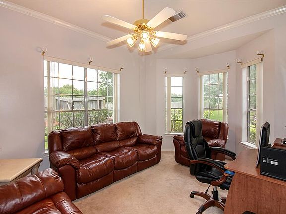 The study is located to the right of the entryway has has a marvelous bay window that overlooks the front yard.