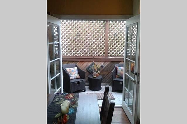 Opening the double french doors to the patio brings the outside in.