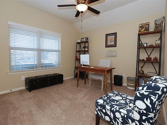 Enjoy high ceilings throughout the home. This bedroom is currently in use as the study.