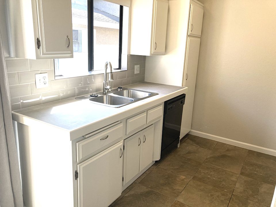 Freshly painted, new counters, sink, faucet and backsplash plus a dishwasher and pantry