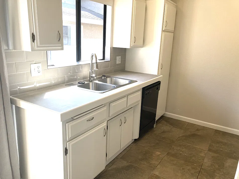 Freshly painted, new counters, sink, faucet and backsplash plus a dishwasher and pantry