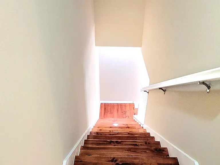 Stairs going down to first floor