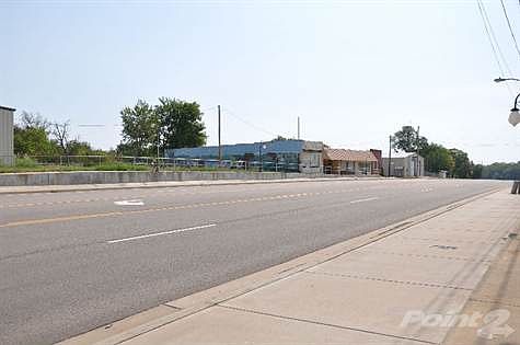 Across and cate-cornered to property.