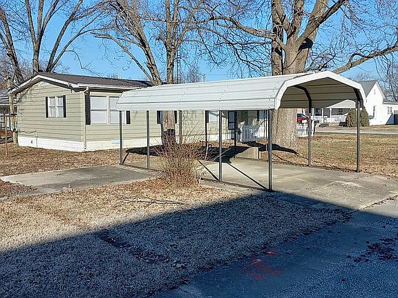 Carport in front of house