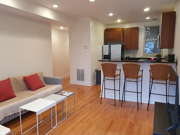 Living room and kitchen with window.