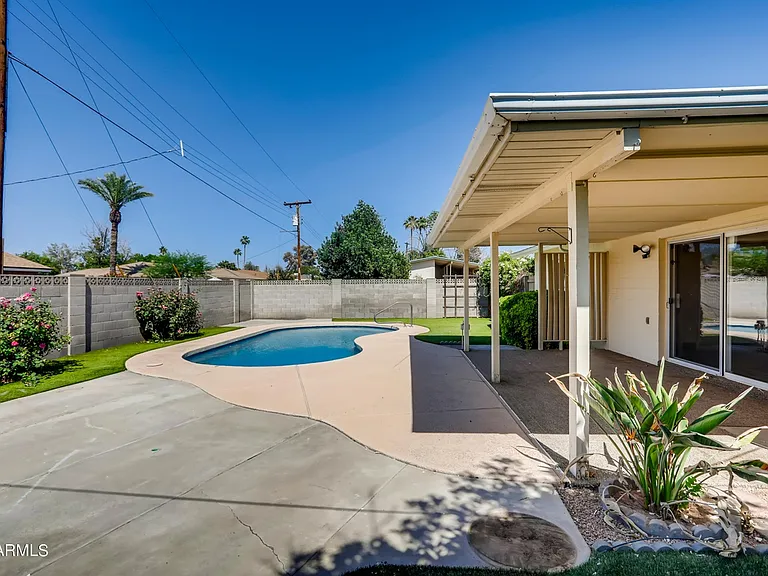 Corner lot backyard with private pool.