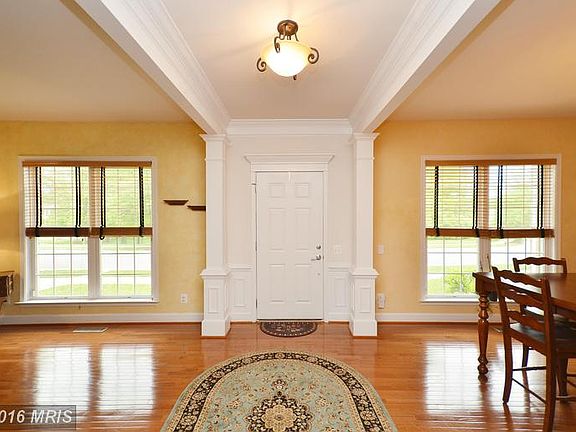 INVITING FOYER WITH HARDWOOD FLOORS