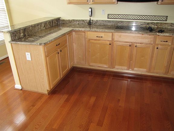 gourmet kitchen with rare granite and cherry hardwood floors
