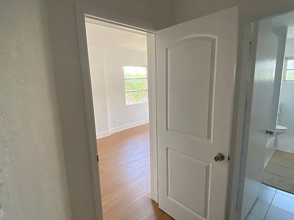 hallway view of bedroom and bathroom