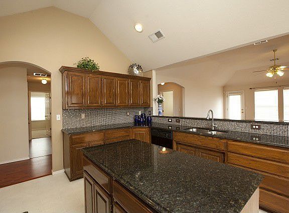 Huge breakfast bar connects kitchen and living