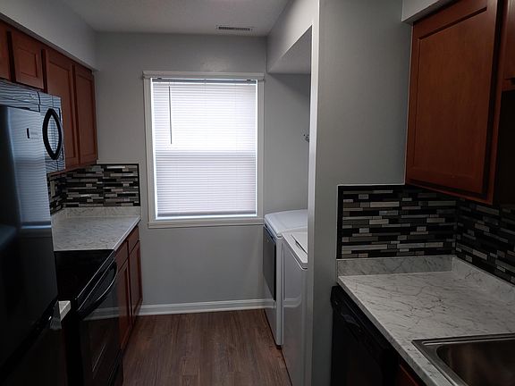 All new appliances including washer and dryer in galley style kitchen.