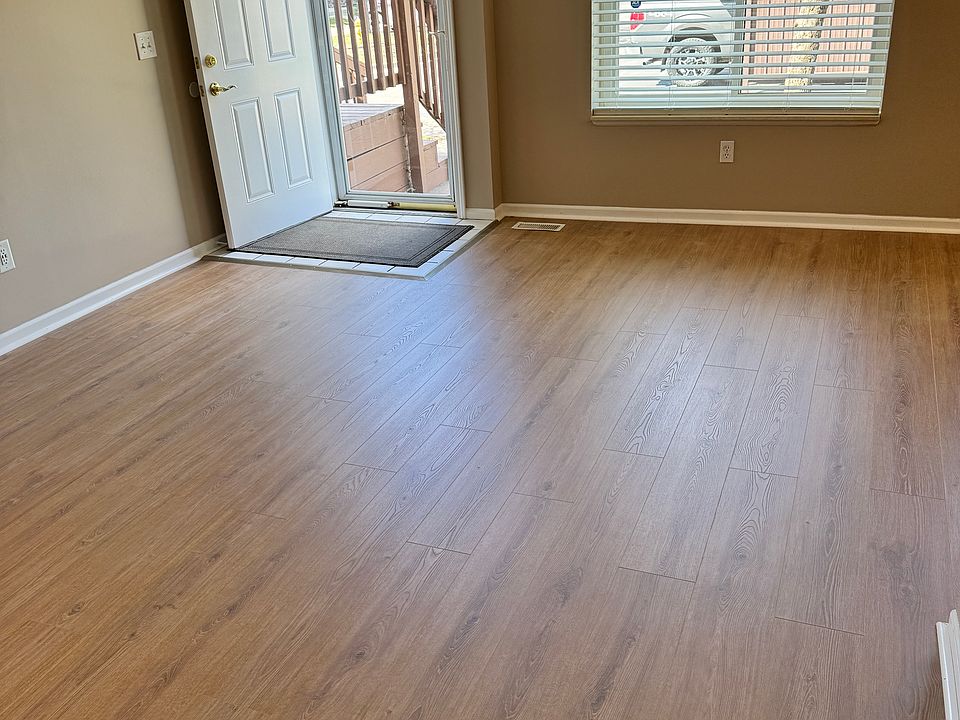 Living room. Carport parking spot seen thru window.