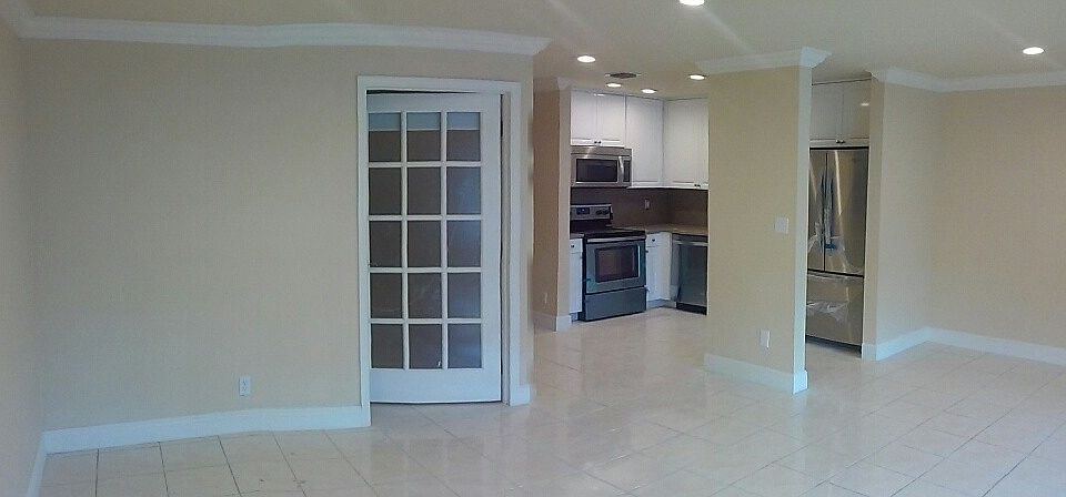 View of 2nd bedroom, kitchen from front door