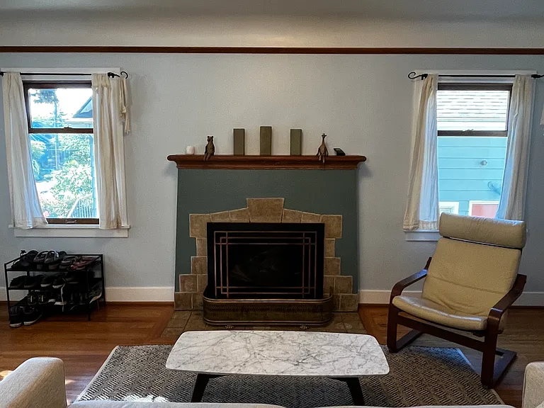 Gas fireplace insert. Coved ceilings and picture rail molding