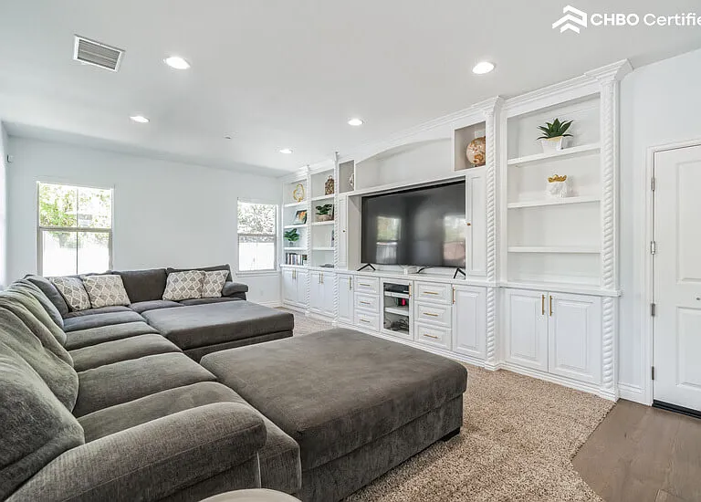Spacious Family Room with Large Sofa and 82" Smart TV