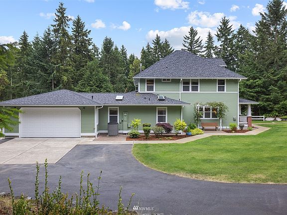 2 Car attached garage all set up with a painted floor, garage fridge and a freezer.  Newer Heat Pump & Water Heater