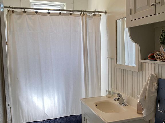 Bathroom with hallway linen closet