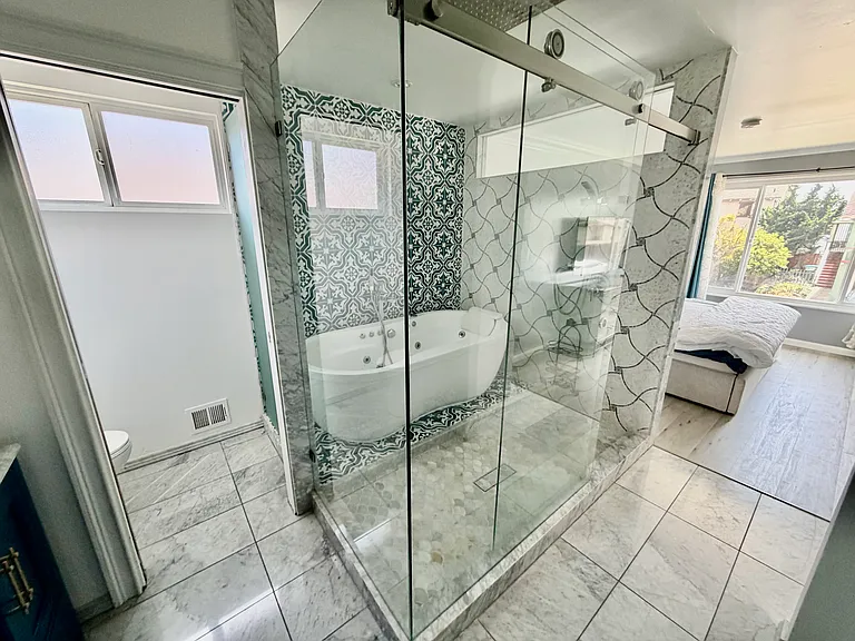 Beautifully renovated Master bathroom with multiple shower heads and Jacuzzi Tub, private bathroom and dual sinks