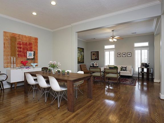 Formal dining is outfitted with the same detailed trim work and gleaming hardwoods. Convenient locat