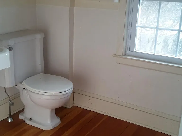 Original full bath with fir floors and cast iron bath