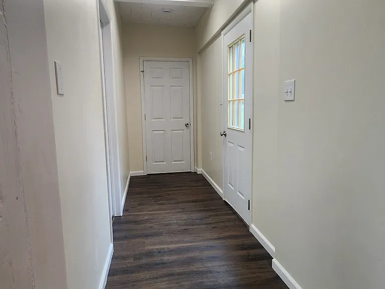 Hallway to Bedroom 4 and exterior door