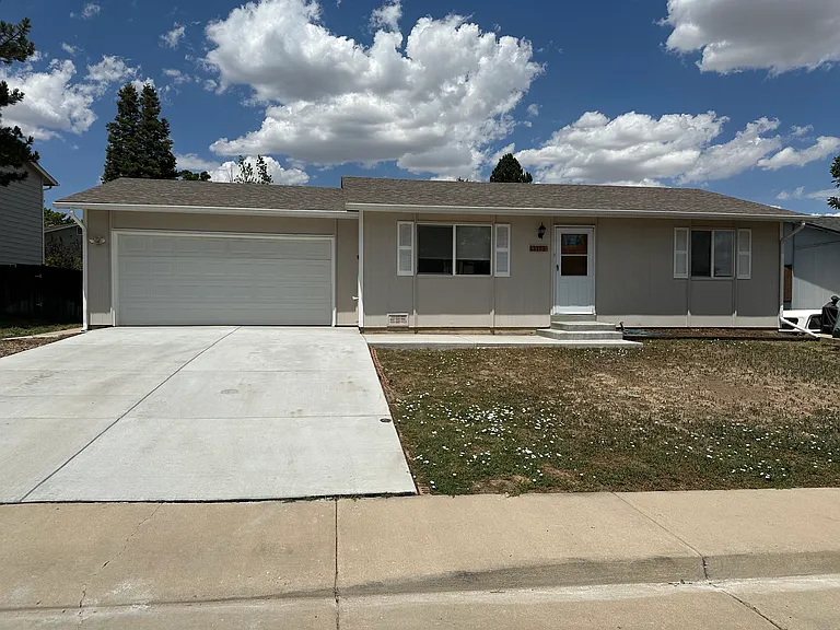 Front of home with attached two car garage.