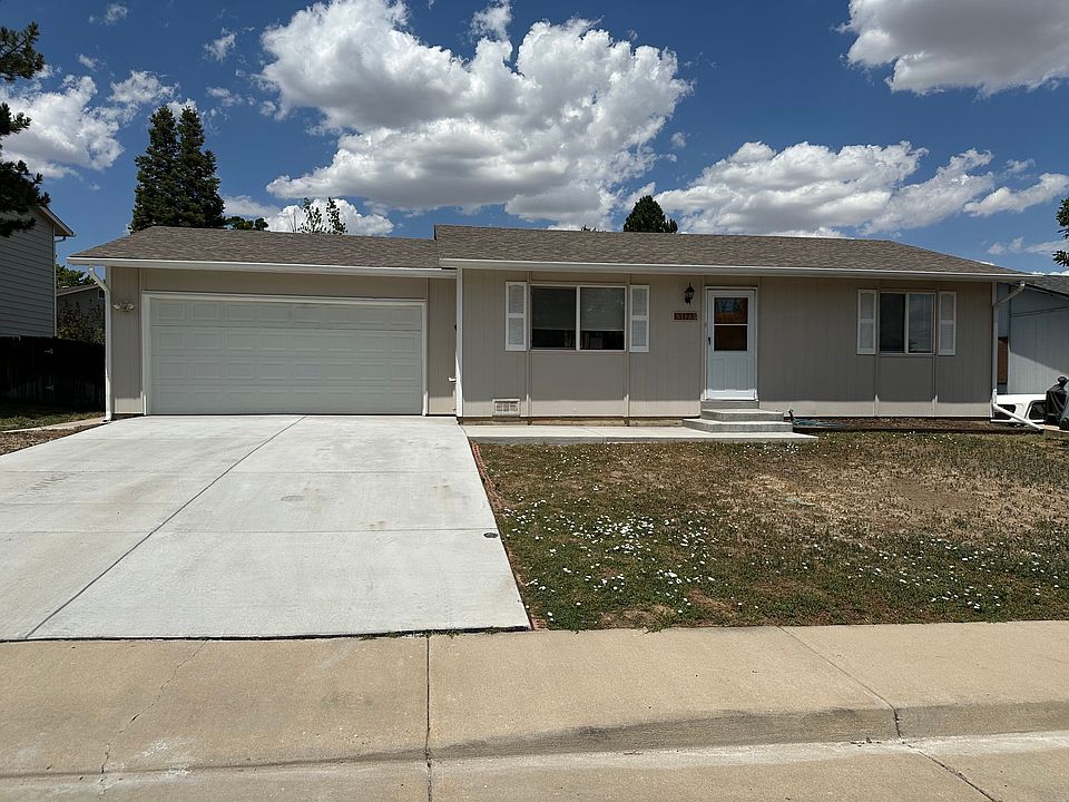 Front of home with attached two car garage.