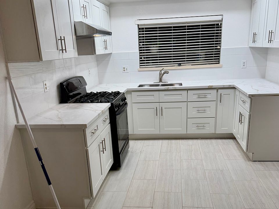 New Kitchen
 New tile floor,New oven and New range hood and sink,cupboards