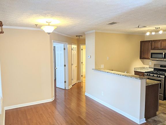 Open concept living, dining and kitchen.