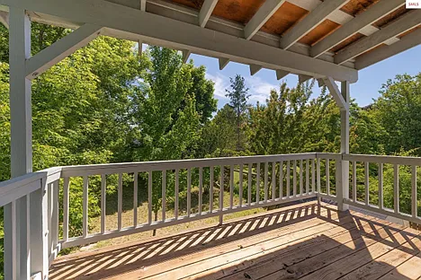 same balcony with view of backyard