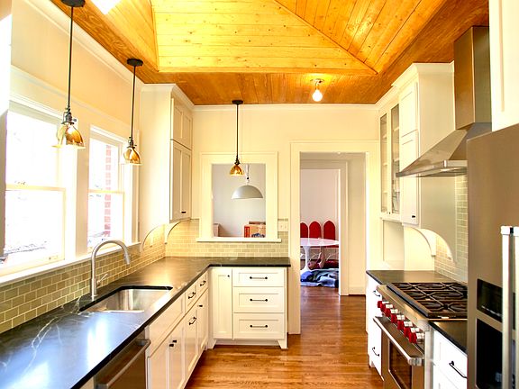 Kitchen with passthrough to eating area and dinning room.