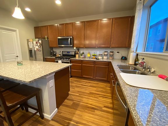 Large island, and peninsula with double basin sink & dishwasher