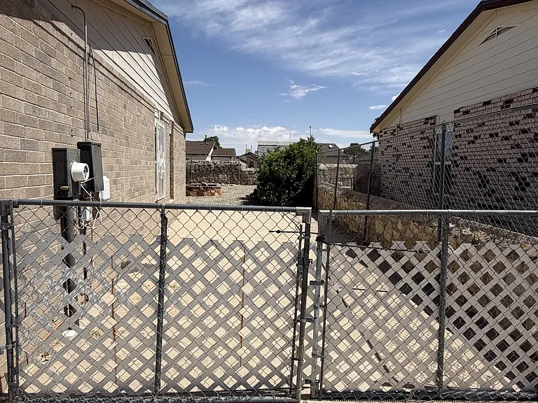 long driveway for protected parking with gate