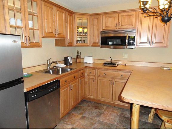 Fully furnished kitchen with SS frig, convection microwave oven, electric hot plate, dishwasher, toaster, coffee brewer, dishes and utensils.