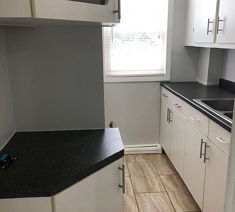 kitchenette with many cabinets