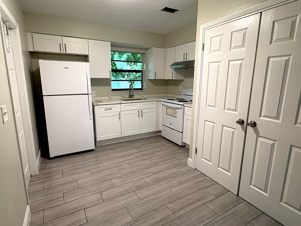 Kitchen with washer dryer hookup in closet in photo. Closet could also be used for storage.