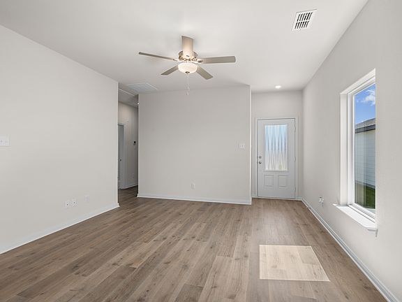 The living room is spacious with lots of natural light.