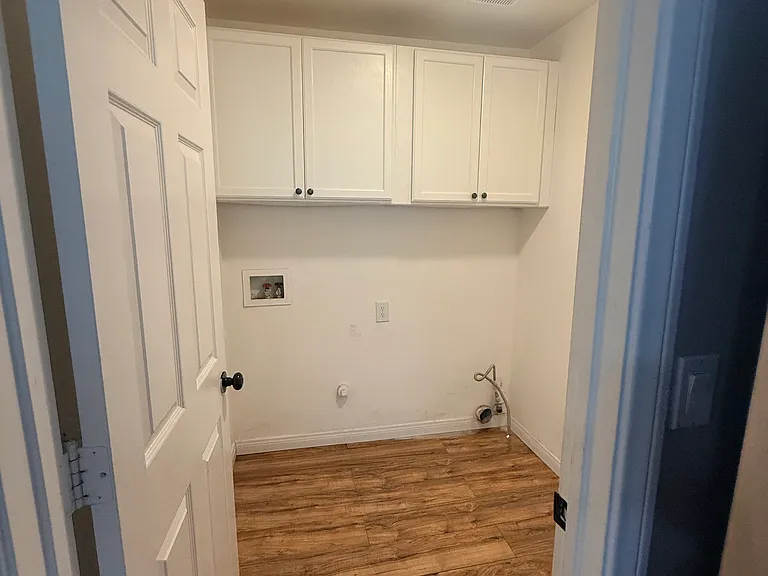 Laundry room downstairs, lead to the garage.