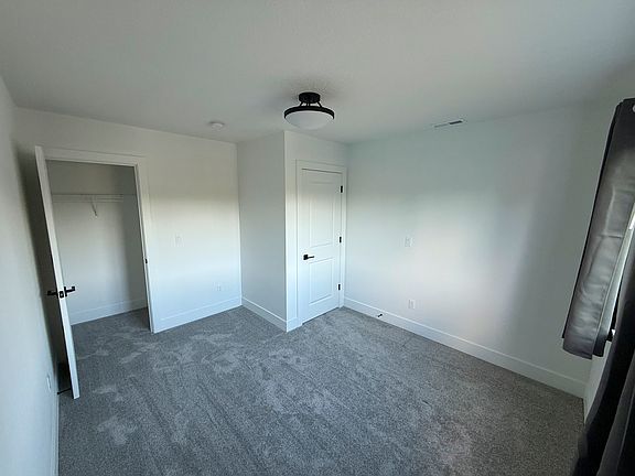 The bedroom available on the top floor of a newly built home near Nike, Costco, and 2 train stations.