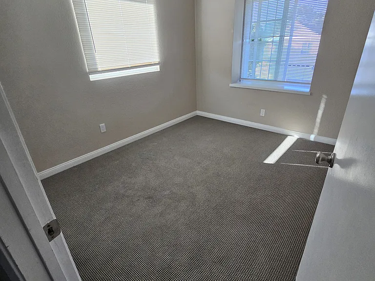 South guest bedroom, see two Window. Note new blinds installed month ago.