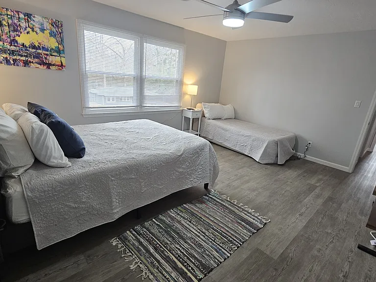 Primary bed - large enough for additional bed that can be set up if the tenant needs it