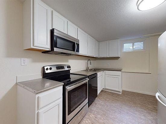 Kitchen with dishwasher, disposal, microwave, stove/oven, refrigerator, pantry, small eating area (not pictured)