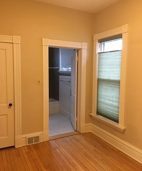 looking from the main floor bedroom/office into the main floor bathroom