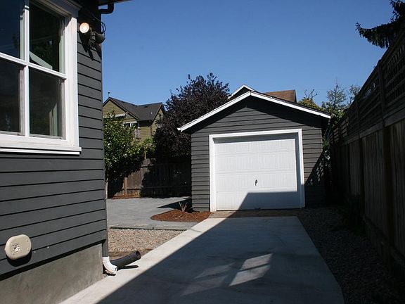 Driveway and detached garage.