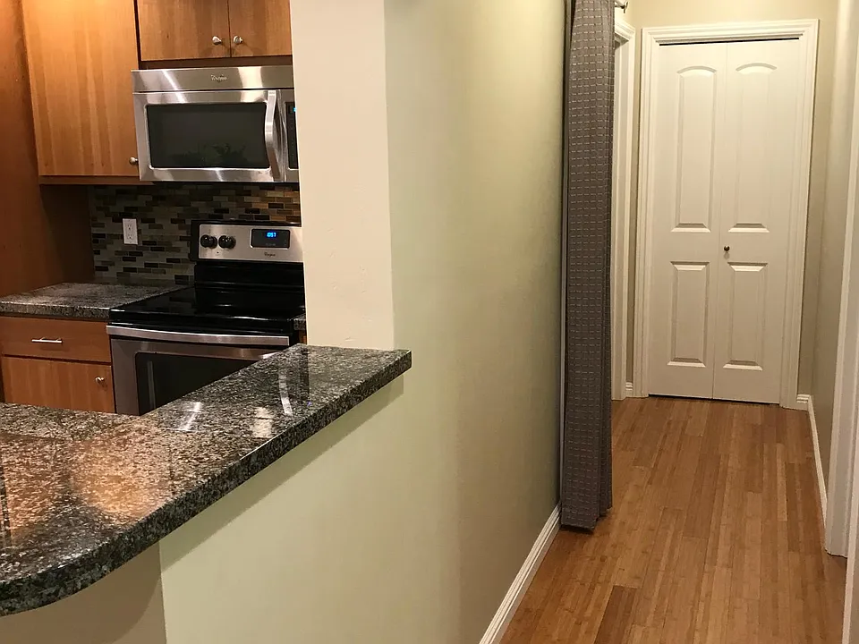 Hallway to master, laundry, bathroom and storage